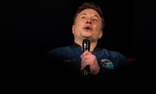 elon musk holding a microphone