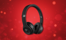 beats solo3 headphones against a red background